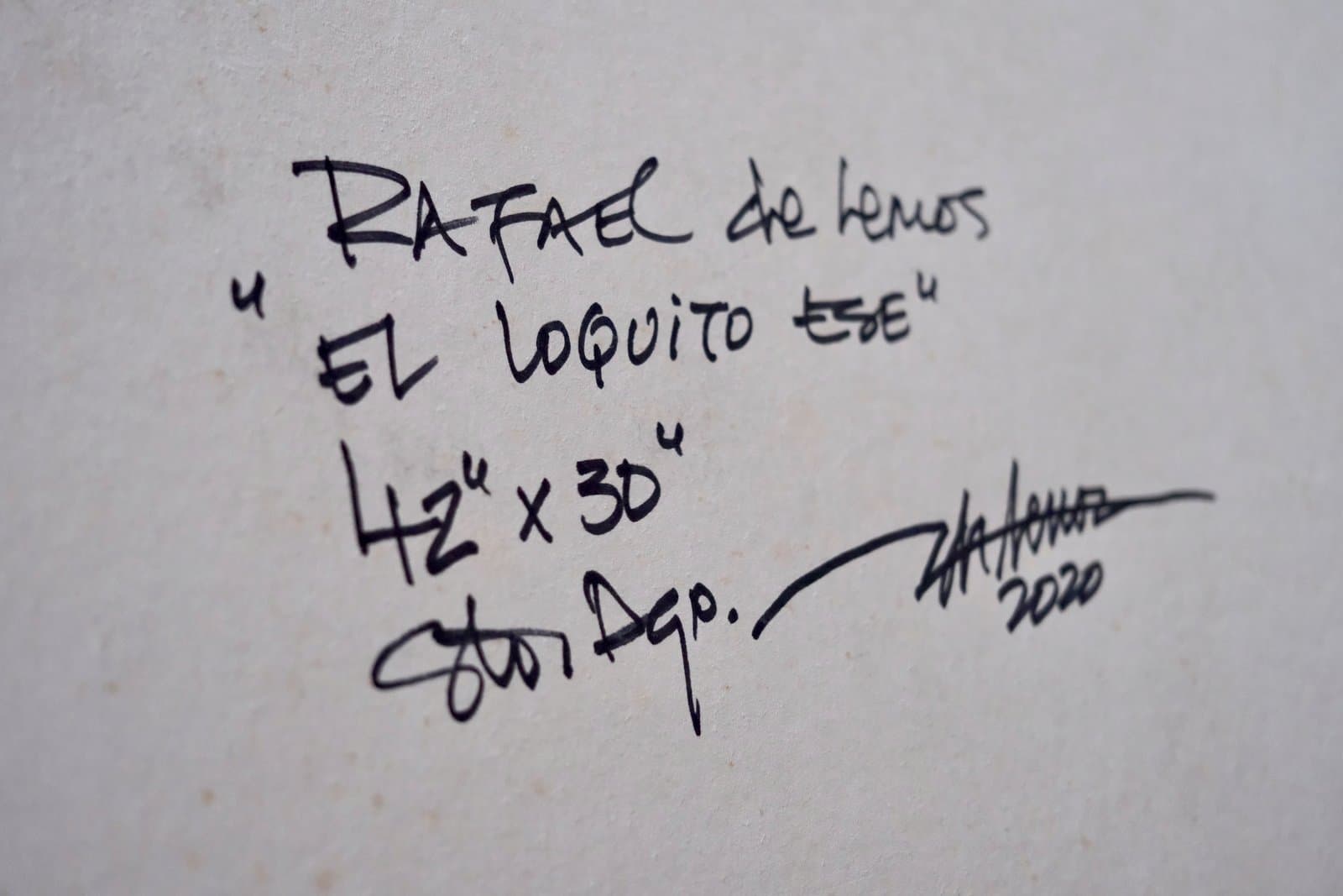 Reverso firmado de "El loquito ese", título, medidas y año manuscritos