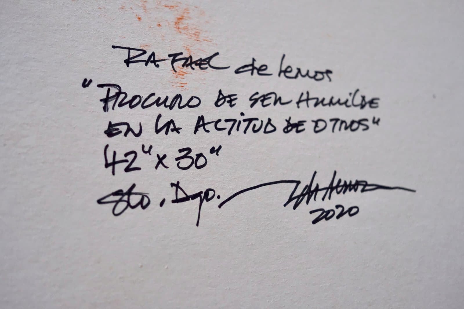 Reverso firmado de "Procuro de ser humilde en la actitud de otros", título, medidas y año manuscritos